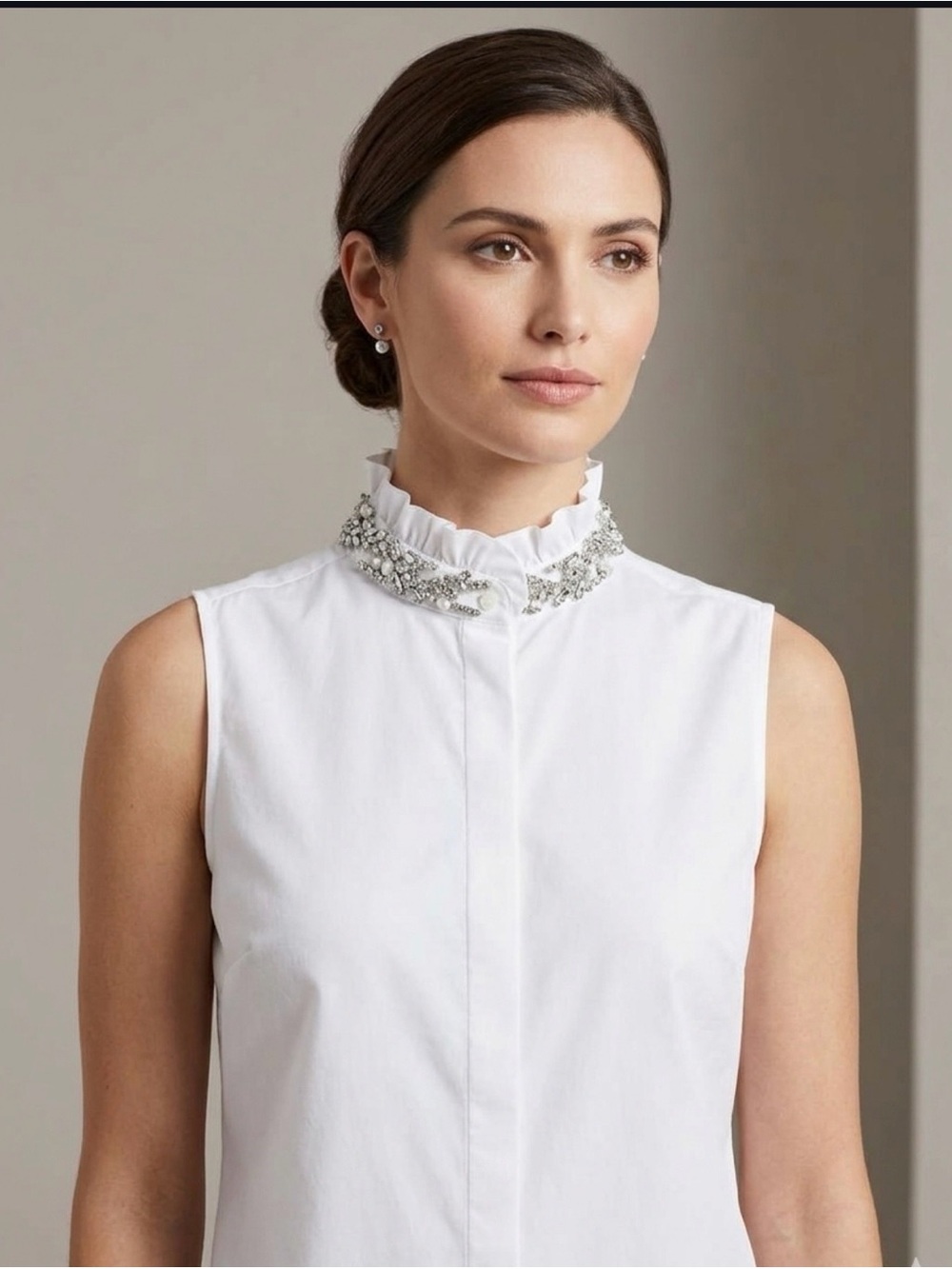 J. Crew woman’s sleeveless white blouse with embellished jewel collar
